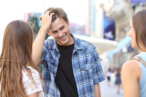 man introduces himself to two women