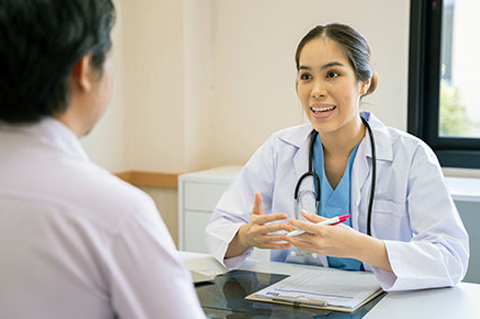 person talks with doctor about health